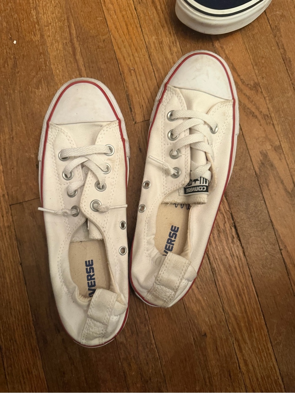 Converse women’s ' Low-Top Canvas Sneakers in White with Red Trim